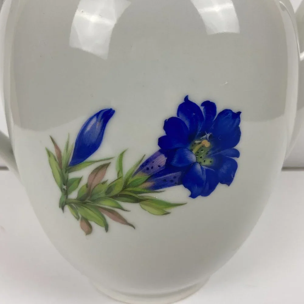 Vintage porcelain large tea pot with the floral decor